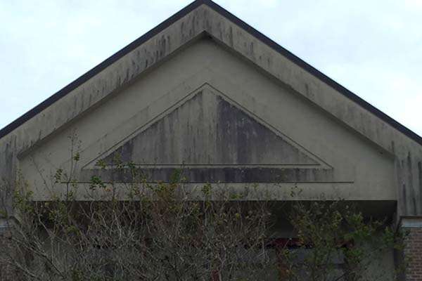 Dirty stucco gable before
